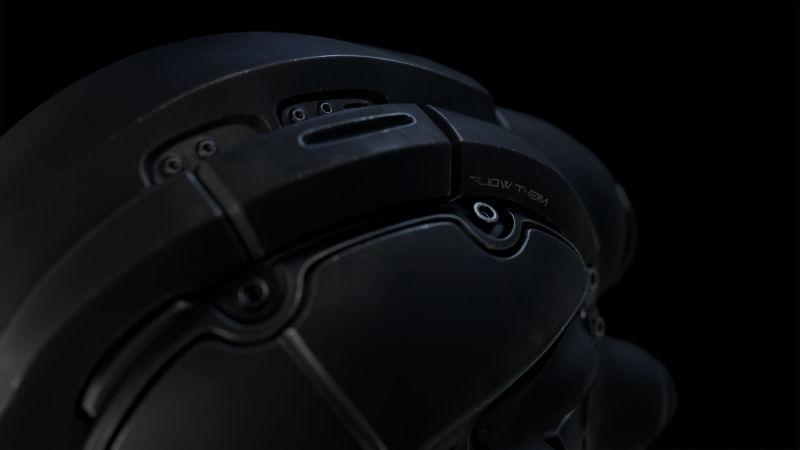 黑色背景下的机器人黑色的头盔3D设计