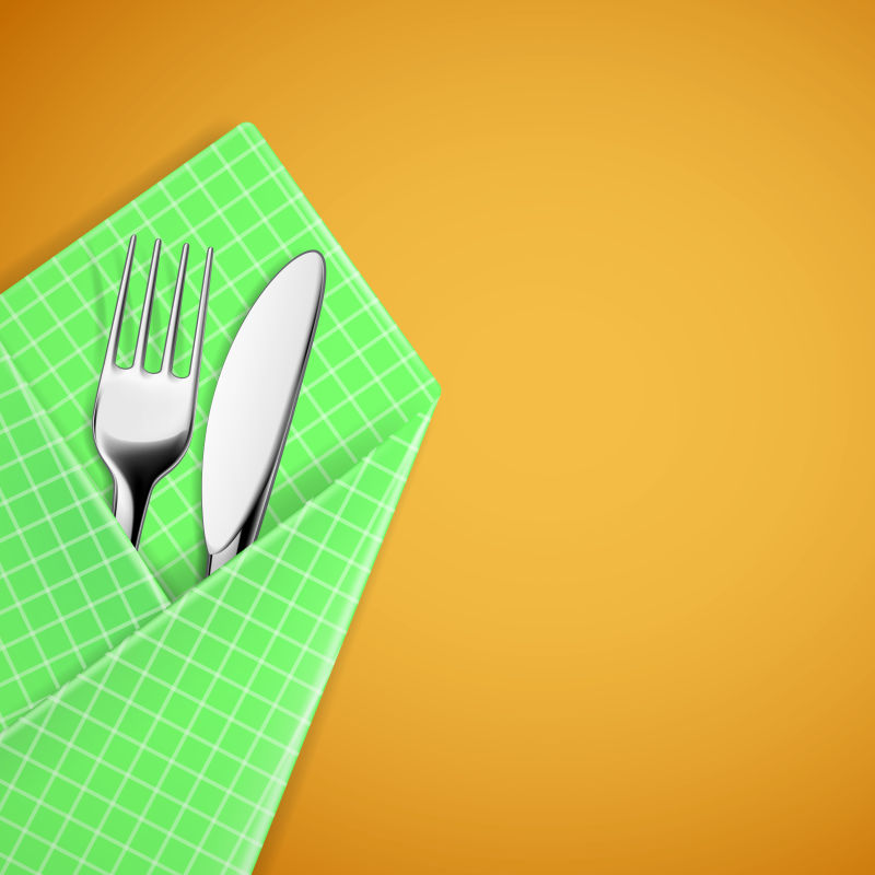 绿色餐巾里的矢量刀叉