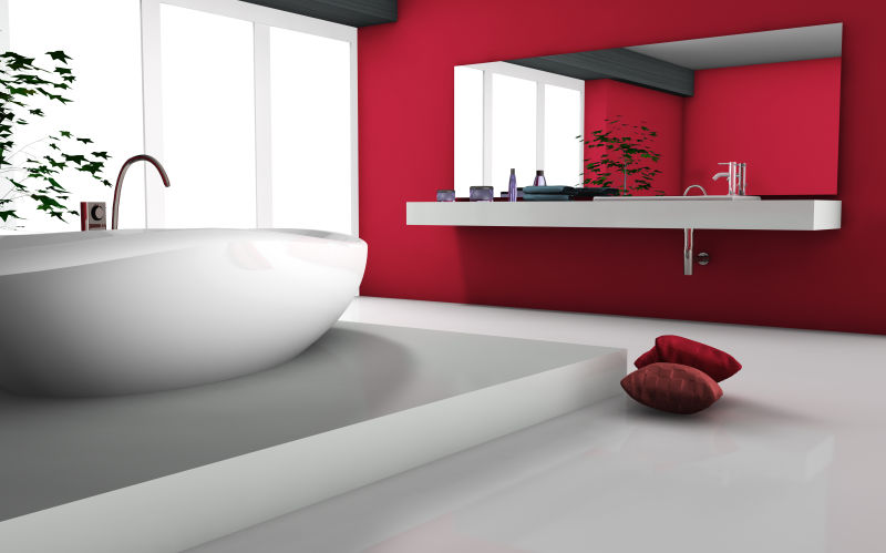 白色浴缸和红色浴室墙