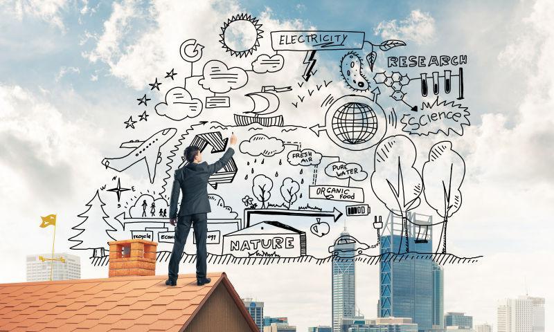 在屋顶上绘制商业漫画的商人