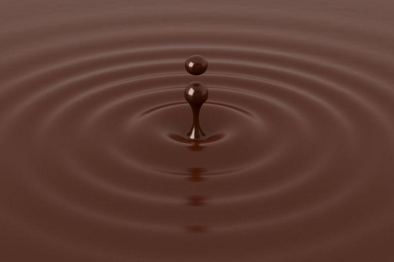 带涟漪的巧克力滴特写镜头