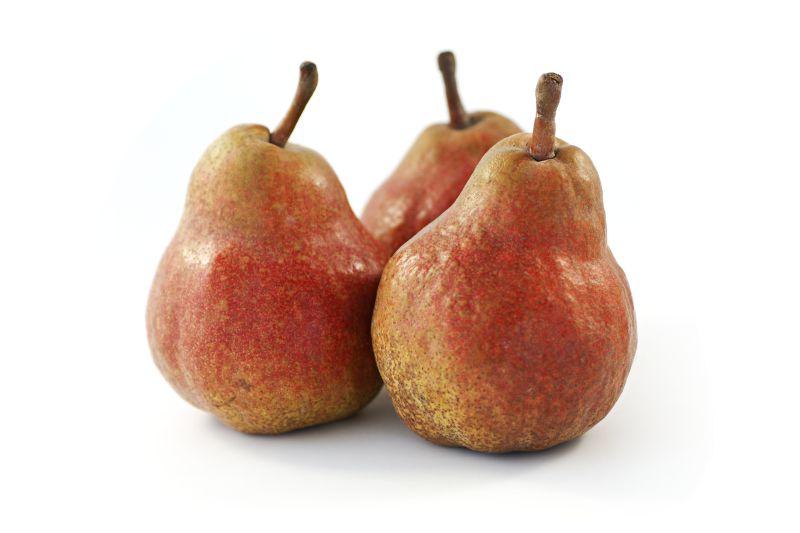 白色桌上的红色梨子