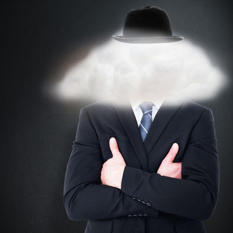 黑色背景下云朵遮住面部的商人