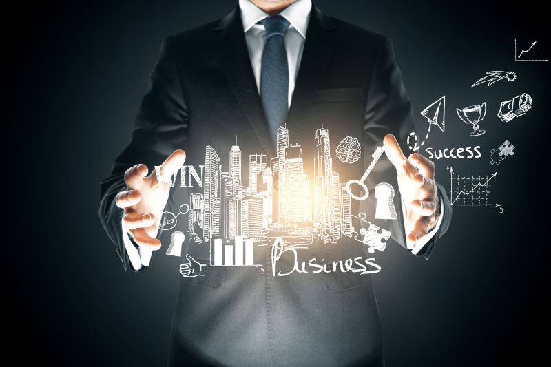 商人在黑暗的背景下手持抽象照明的商业草图