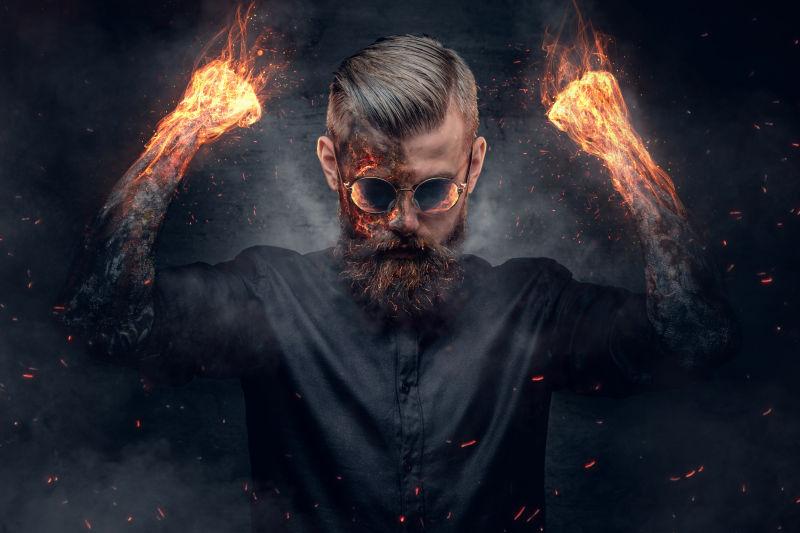 燃烧着冒着烟和火星的男性