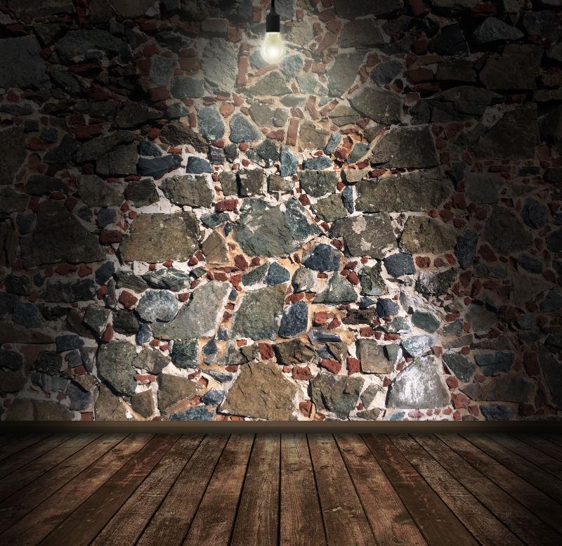 墙壁上的石头与电灯泡