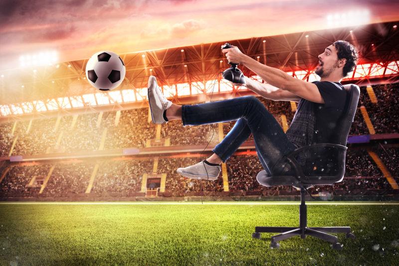 拿游戏杆的男人玩足球游戏