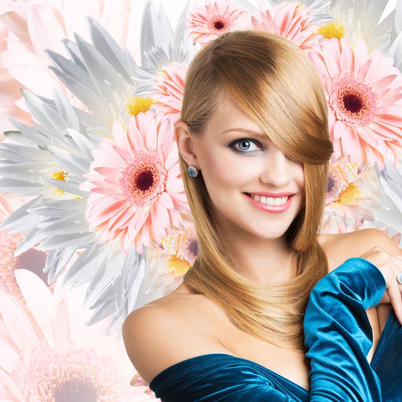 粉色背景下的白色菊花花朵和穿着宝蓝色天鹅绒衣服的美女