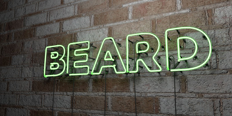 胡须光霓虹灯在石墙墙上