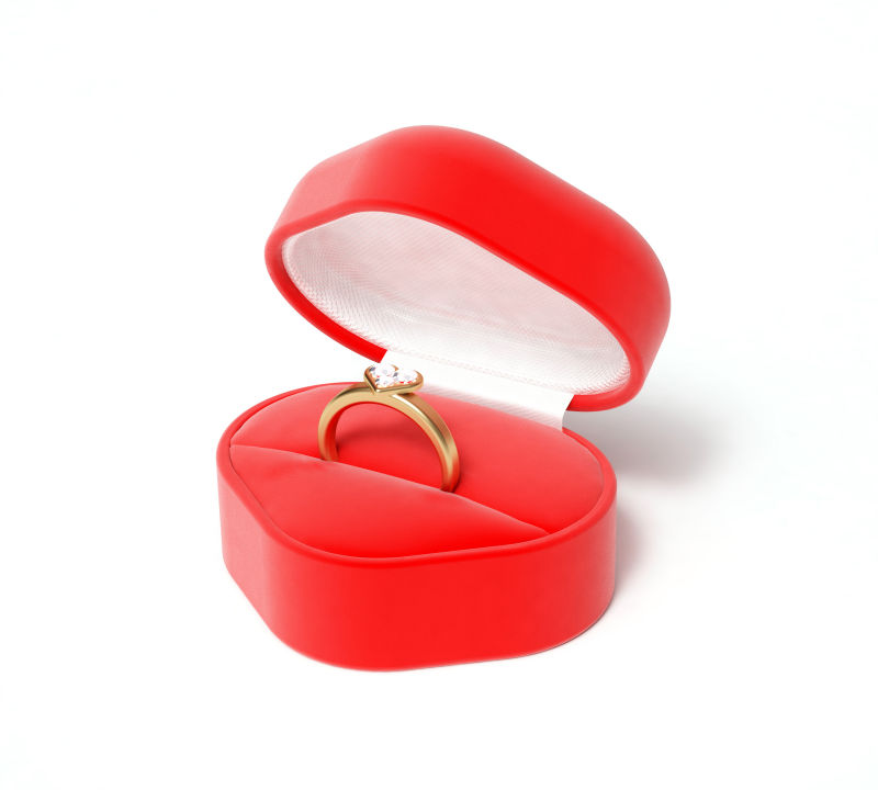 情人节红盒子和镶有钻石的金戒指