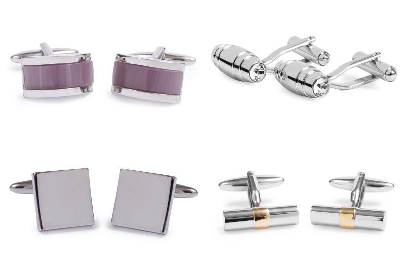 白色背景中的不锈钢袖扣