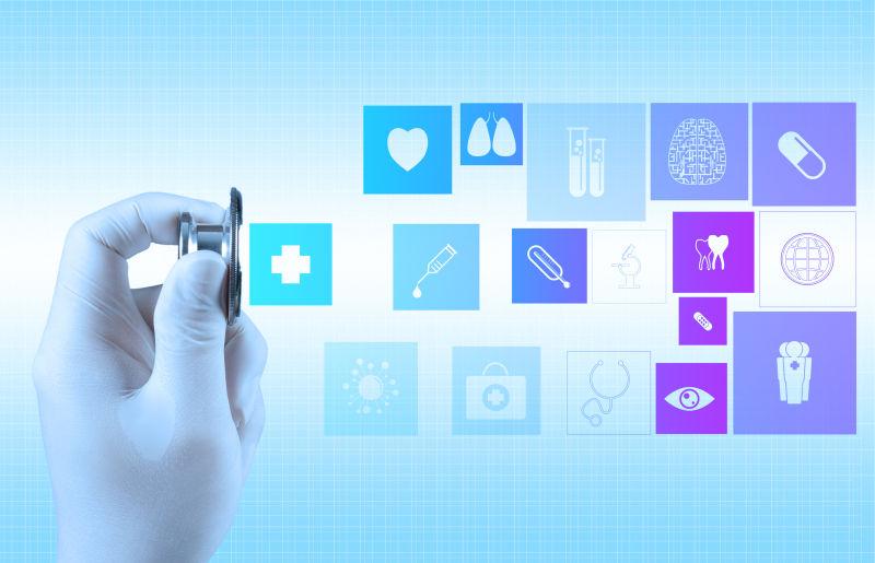 蓝色的拿着听诊器的手和科学医疗理念