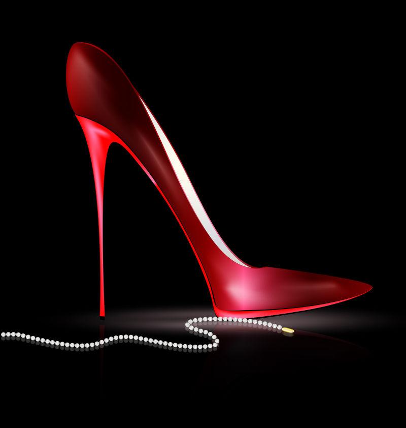 黑色背景中的红色高跟鞋与珠子