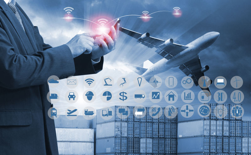 全球物流运输概念背景上使用手机的商人