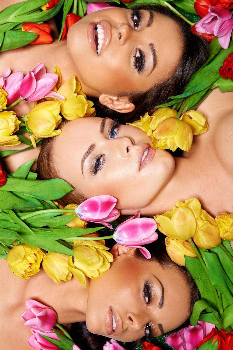 头躺在郁金香中的三位美女