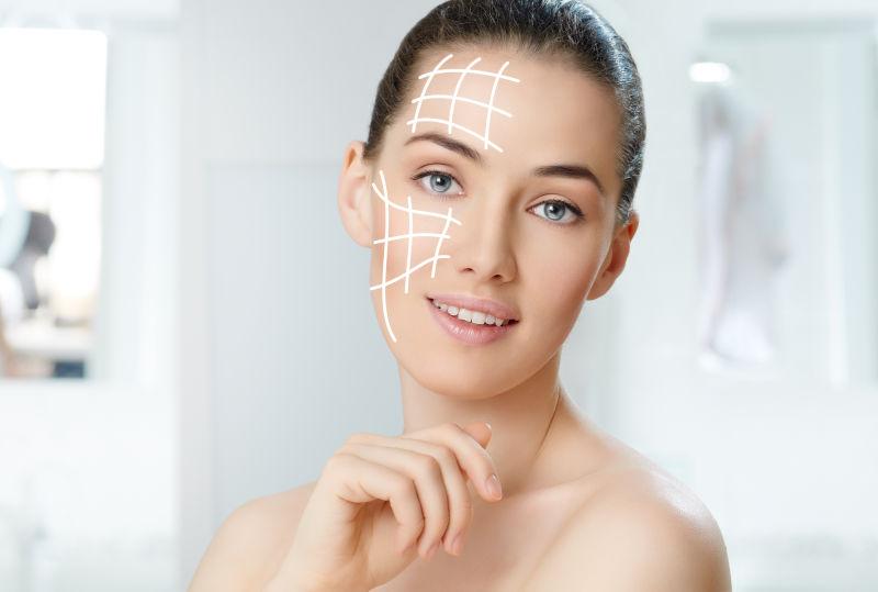 模糊背景上脸部标有箭头的美女