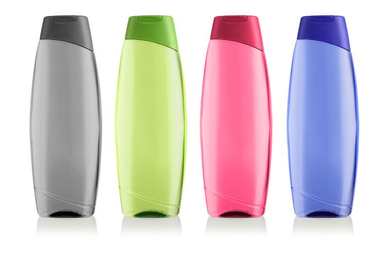 白色背景上的彩色化妆品包装瓶子