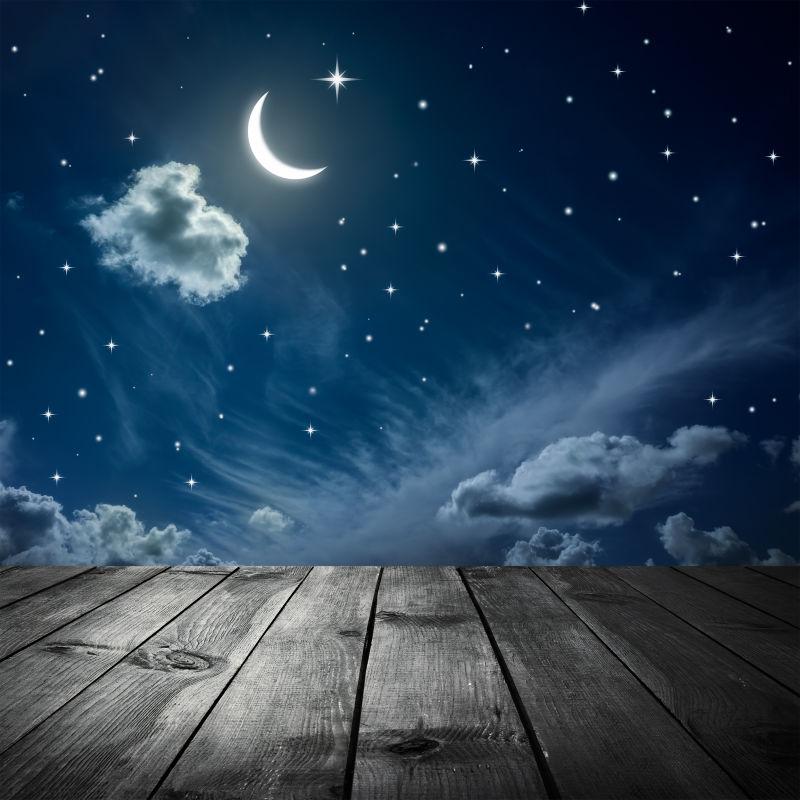 夜间星系背景前的木桌图片 夜晚美丽星空背景前的木桌素材 高清图片 摄影照片 寻图免费打包下载