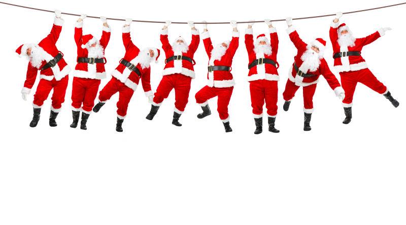 白色背景中挂着绳子上的圣诞老人拼贴