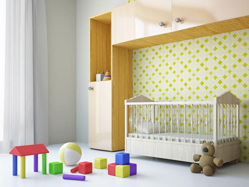 放着婴儿床衣柜和玩具的房间