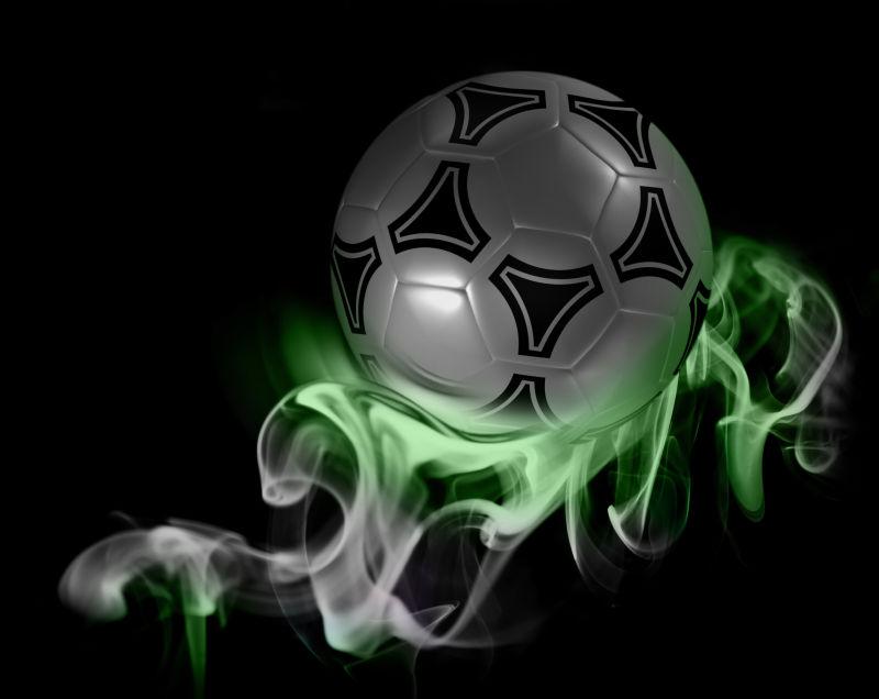 黑色背景上的彩色烟雾足球创意