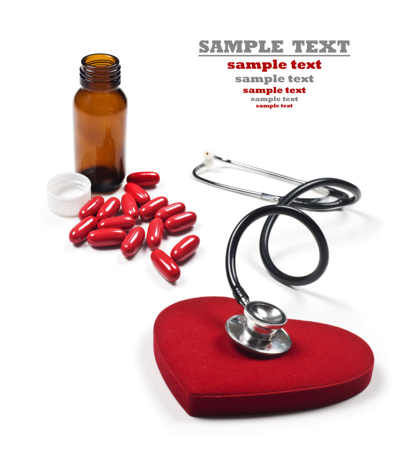 红色爱心听诊器与红色药丸