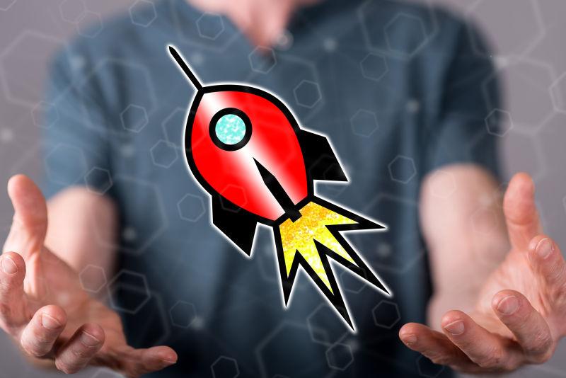 男人手里发射的卡通火箭