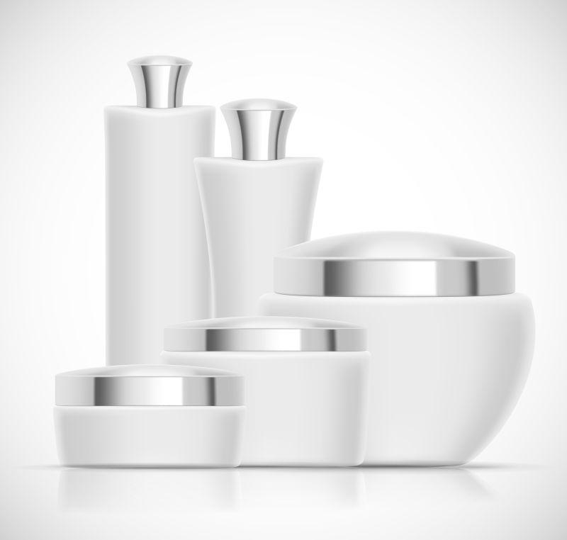 一套带有银帽的奢华化妆品矢量包装