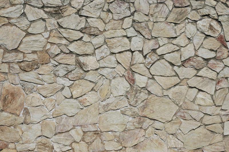 不规则小柿子石头墙的背景