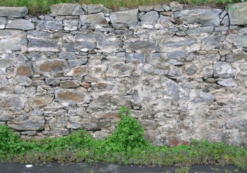 裂缝的石墙背景