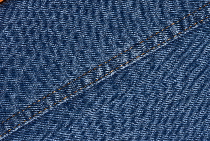 以蓝色牛仔裤的特写纹理为背景