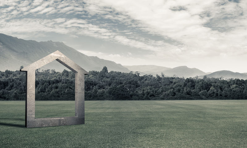 青草上混凝土家居标志的概念背景图像