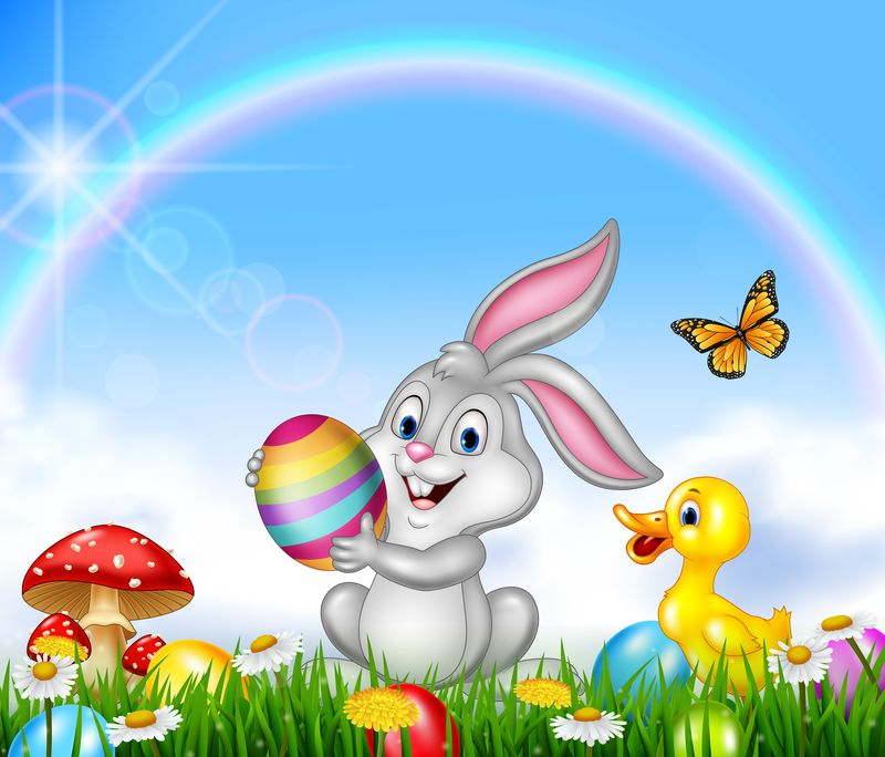 快乐小兔子拿着大自然背景的复活节彩蛋
