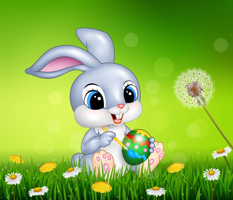 在田里装饰复活节彩蛋的复活节兔子