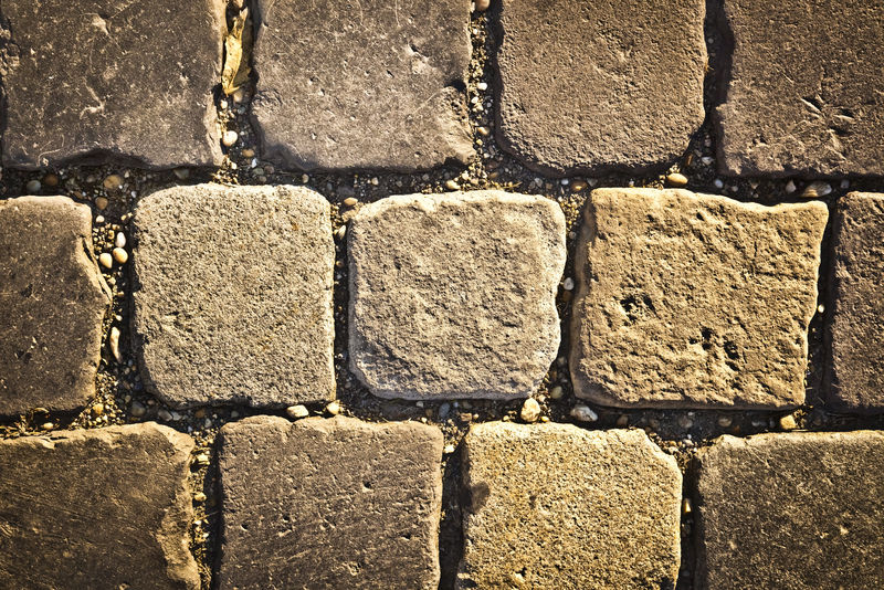 装饰性的，由鹅卵石、背景、纹理构成的老路
