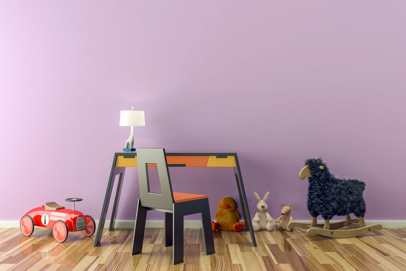 空荡荡的儿童房，里面有玩具、办公桌和椅子。