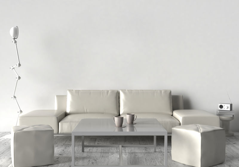 客厅，沙发，两张凳子和桌子。在空荡荡的墙上