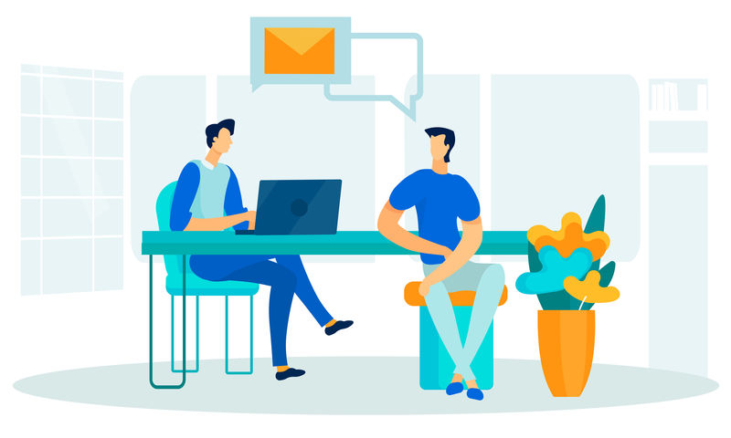 办公空间和办公人员坐在桌子旁边