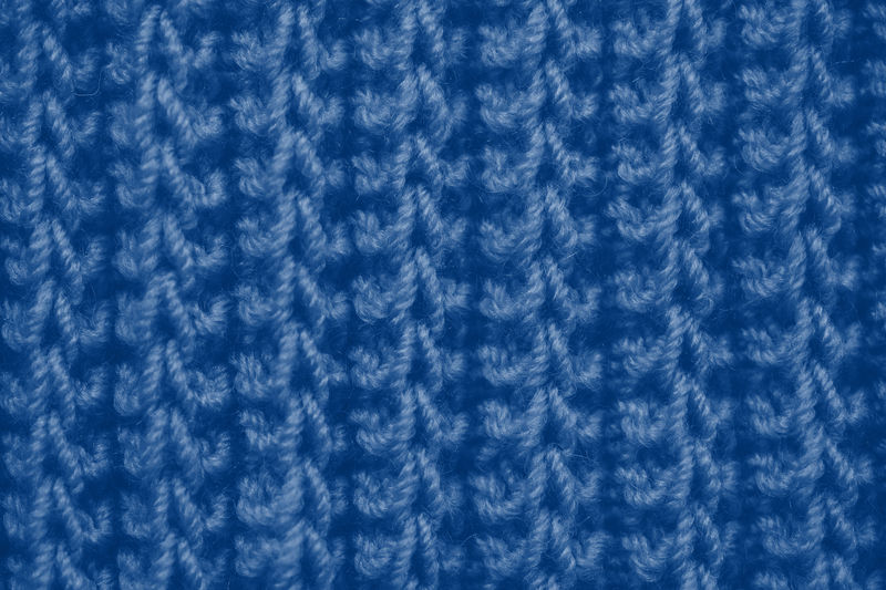 织物橙色针织纹理背景与围巾服装