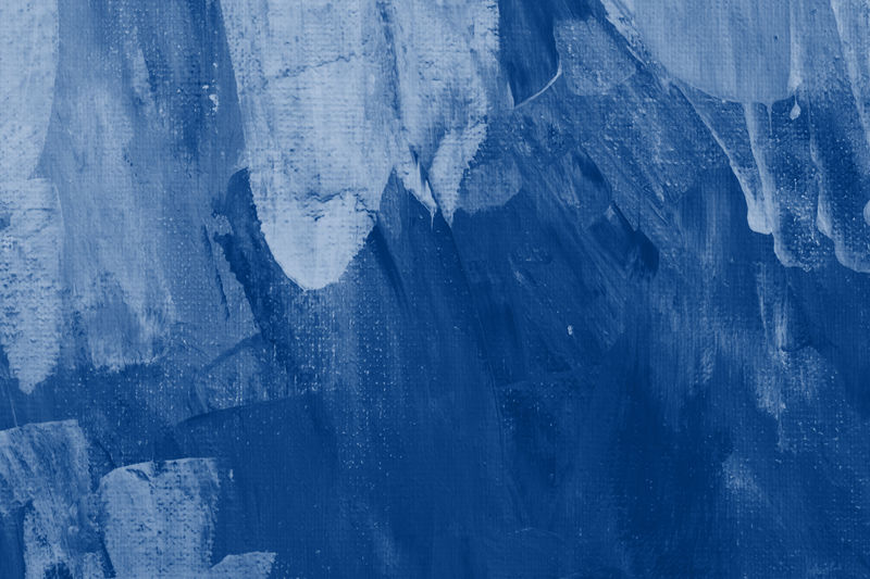 古典蓝色调抽象艺术背景手绘亚克力画。在画布上刷彩色纹理丙烯酸漆。艺术设计图片。时尚2020年色彩