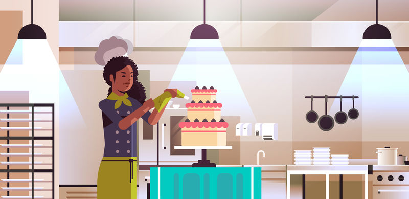 女性专业厨师糕点厨师装饰美味的婚礼奶油蛋糕非洲裔美国女性统一烹饪食物概念现代餐厅厨房内部平面肖像水平