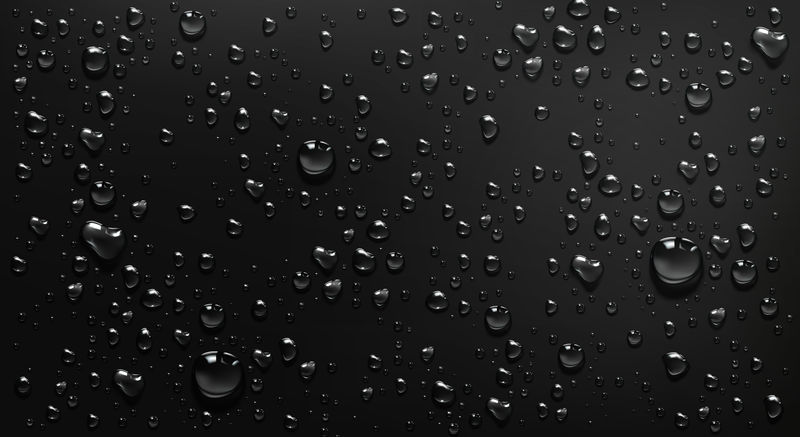 凝结水滴在黑色玻璃背景上素材