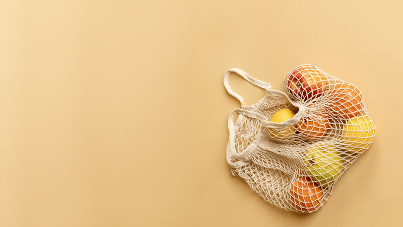 可重复使用的橙色背景水果网袋
