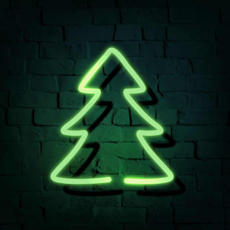 黑色砖墙上的圣诞树霓虹灯标牌