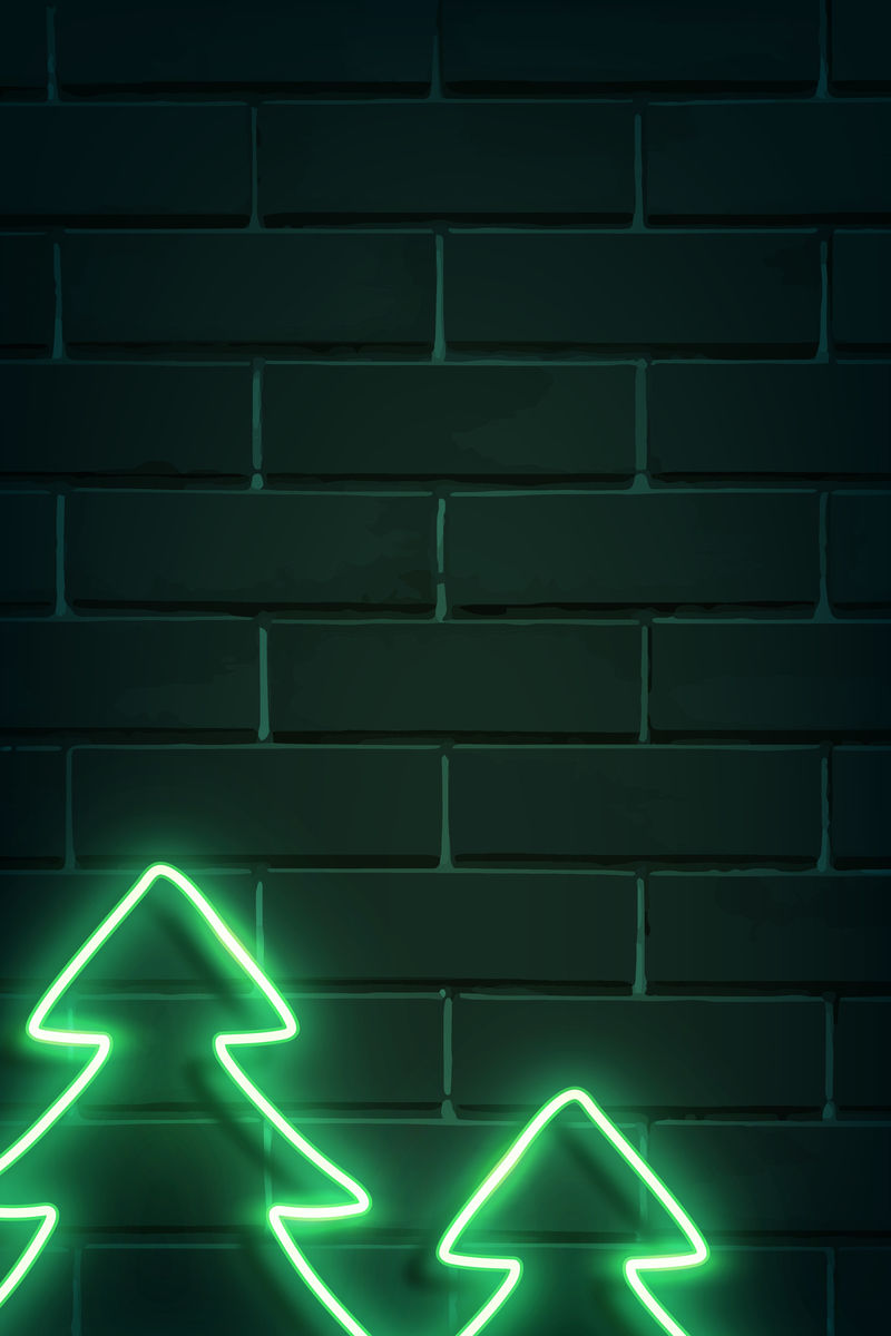 黑色砖墙载体上的圣诞树霓虹灯标志