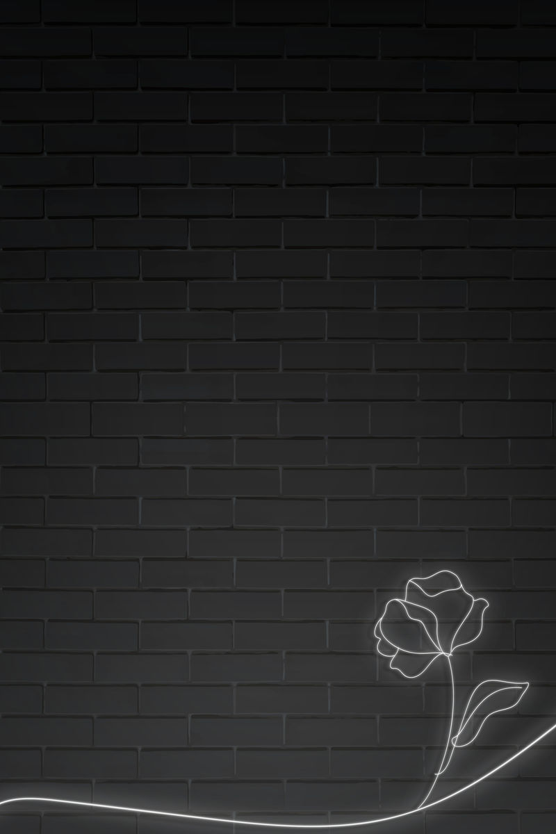 霓虹灯黑色砖墙上的花插图