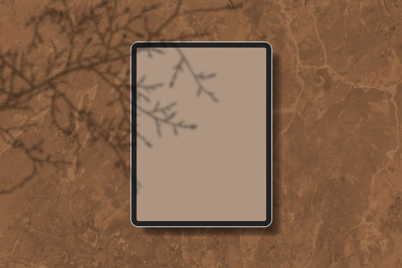 棕色大理石背景向量上的数字平板模型