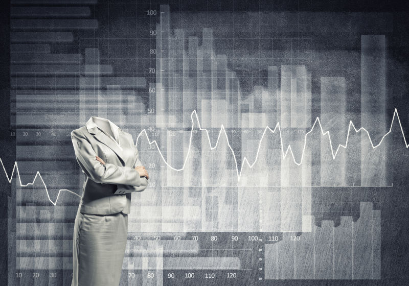 经济统计图背景下的无头女商人
