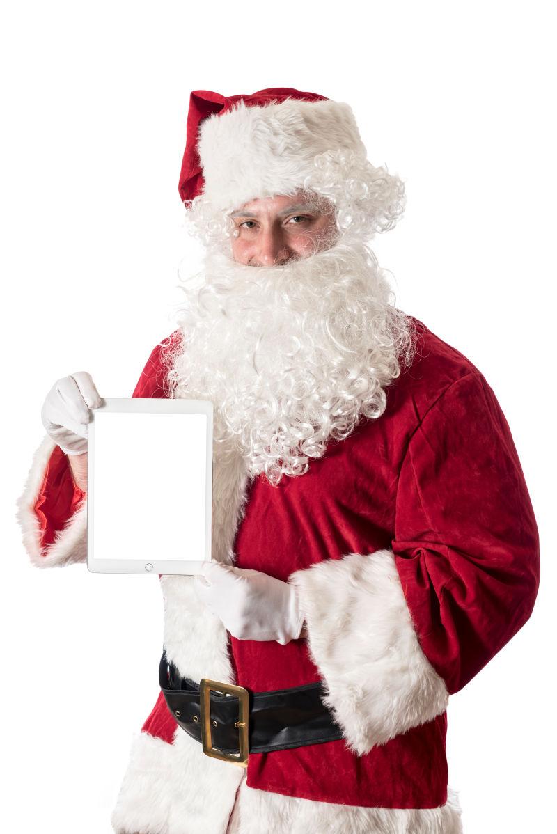 白色背景下拿着平板的圣诞老人