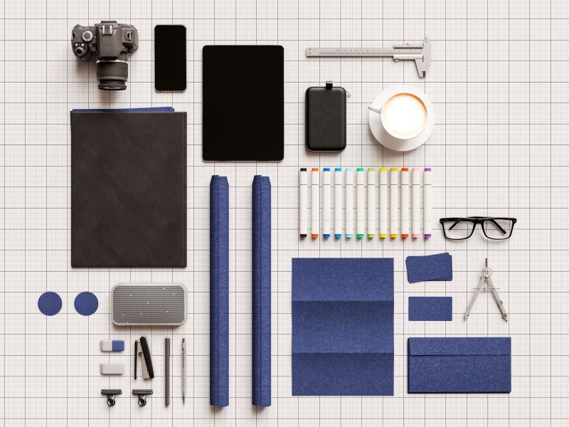 白色桌子上摆放整齐的文具模型